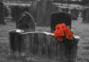 119829-blank-headstone-in-graveyard-with-bunch-of-red-roses